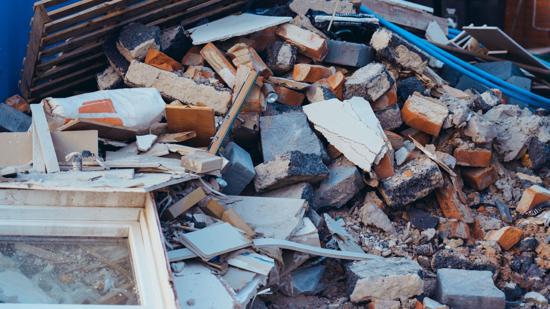 A pile of rubble sitting next to a window